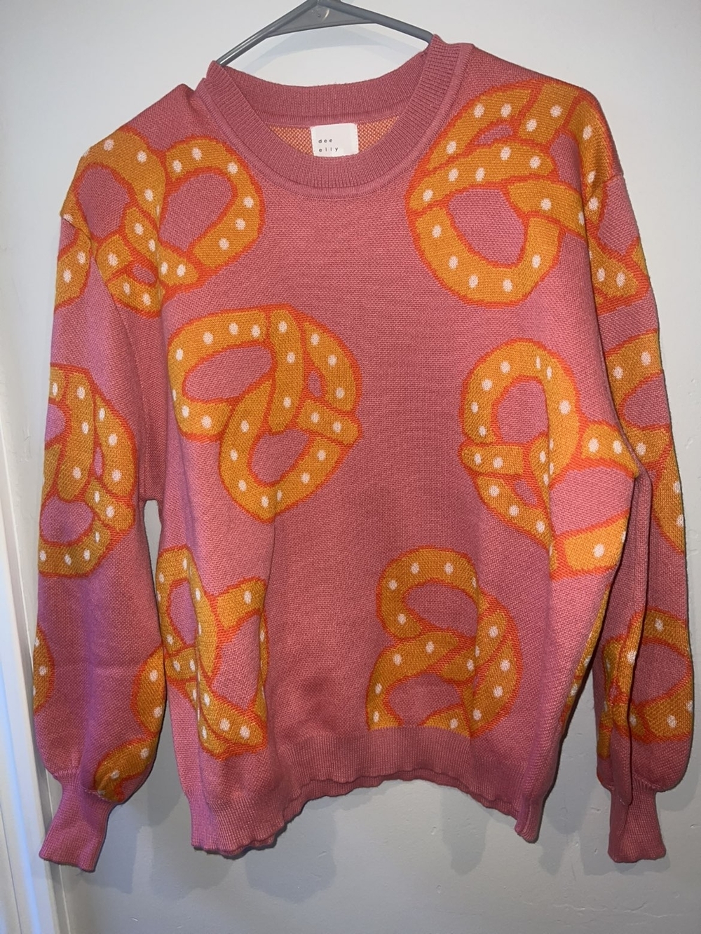 Pink Crewneck Sweater with Orange Pretzel Motif